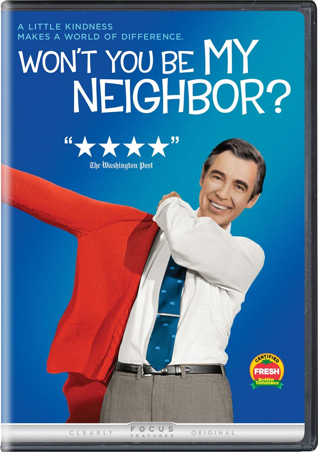 Won't You Be My Neighbor? Mr. Rogers putting on a sweater.