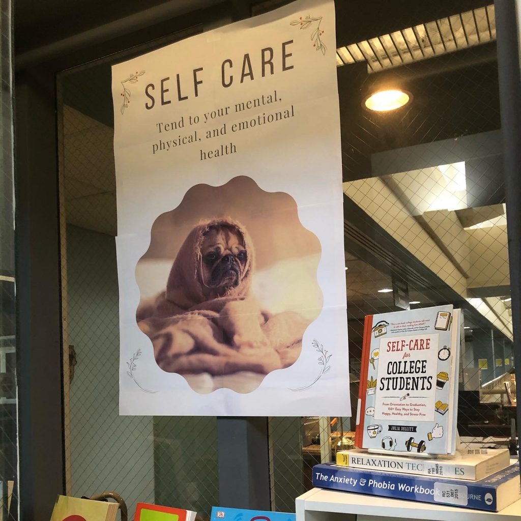 Self care poster with a pug wrapped in a blanket.