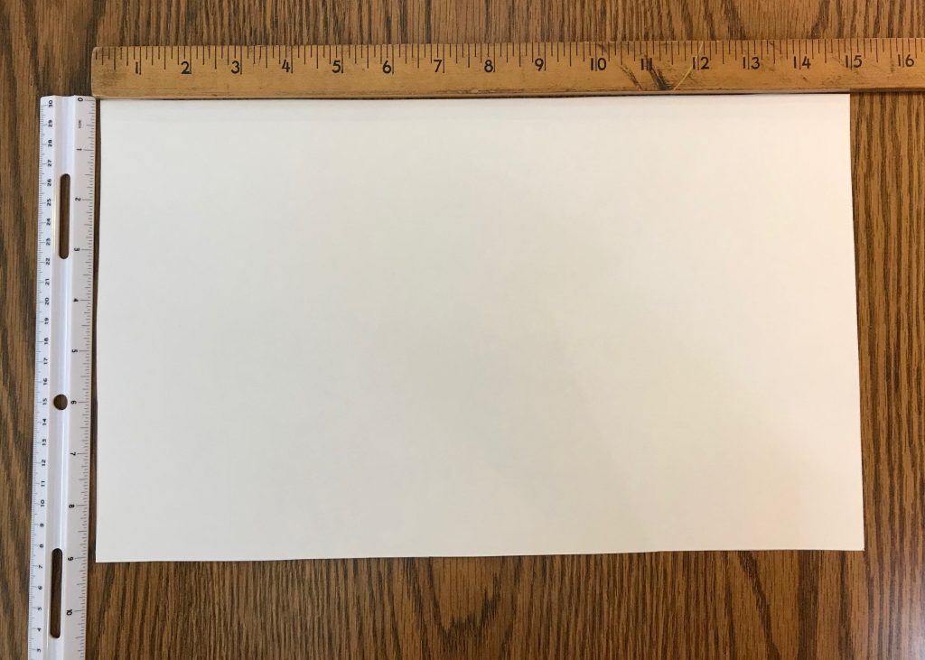 piece of posterboard cut to 15 inches by 9 inches