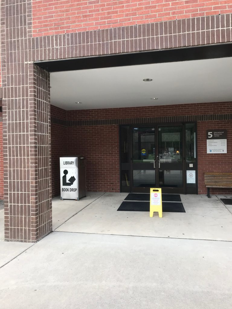 silver library book drop shown outside Building 5 doors