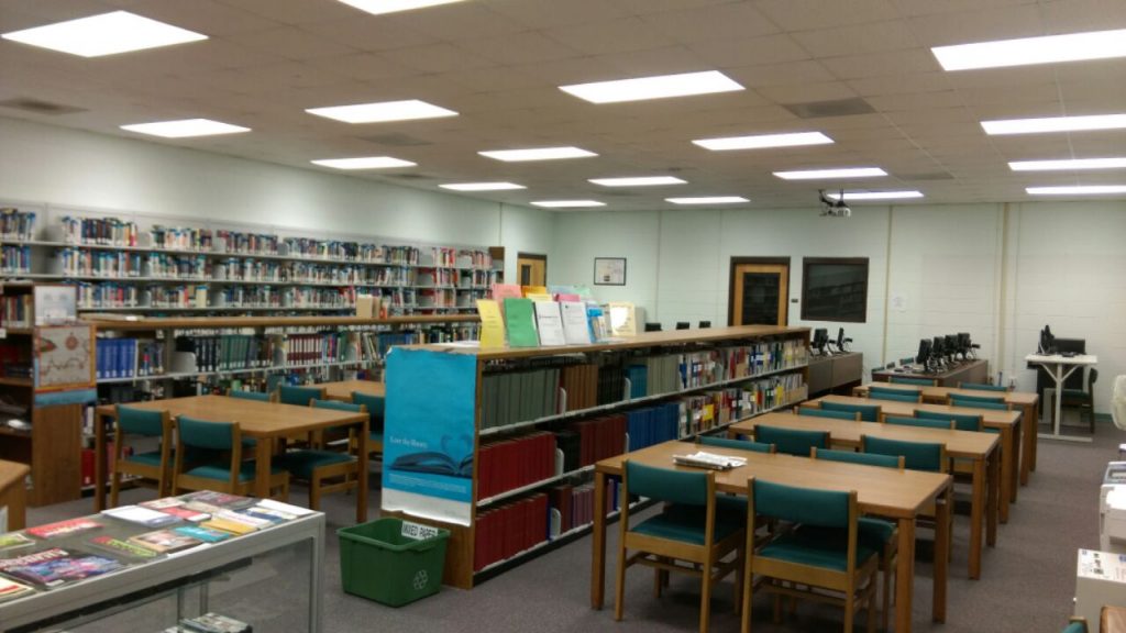 Northern Durham Center Library space, with study tables and bookshelves